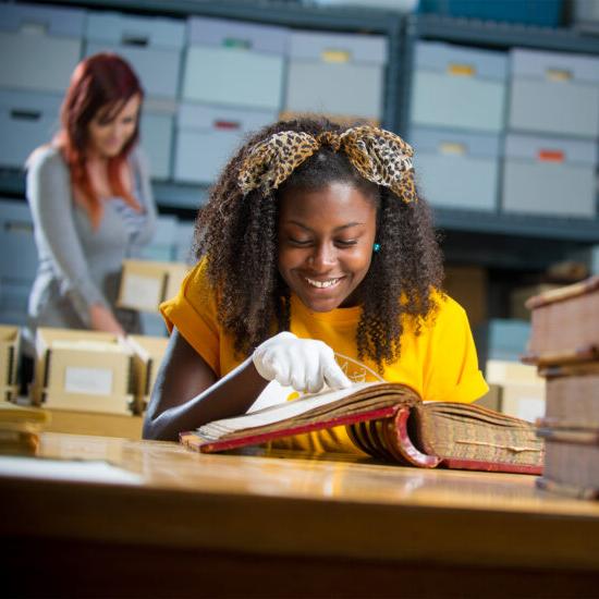 History student examine historical book.